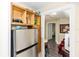 Compact kitchenette with a stainless steel refrigerator and open shelving at 1413 Dorothy Ave, Haines City, FL 33844