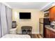 Living area with a bed, small dining table, and kitchenette at 1413 Dorothy Ave, Haines City, FL 33844