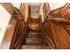 Intricate wooden staircase with detailed paneling leading to the upper level at 1413 Dorothy Ave, Haines City, FL 33844