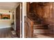 Wooden staircase with detailed paneling in the entryway at 1413 Dorothy Ave, Haines City, FL 33844