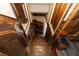 View of the wooden staircase with decorative paneling and dark stained wood at 1413 Dorothy Ave, Haines City, FL 33844