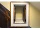Close-up of the under-stair storage compartment with white trim and wooden doors at 1413 Dorothy Ave, Haines City, FL 33844