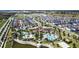 Aerial view showcasing the community pool, clubhouse, and surrounding homes at 1567 Carey Palm Cir, Kissimmee, FL 34747