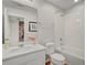 Clean and bright bathroom with white vanity, toilet, and bathtub at 1567 Carey Palm Cir, Kissimmee, FL 34747