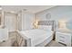Bedroom with a gray bed, white bedding, and bedside tables and lamps at 1567 Carey Palm Cir, Kissimmee, FL 34747