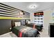 ' bedroom featuring two twin beds, themed decor, and a playful ambiance at 1567 Carey Palm Cir, Kissimmee, FL 34747