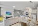 Stylish open-plan living and dining area with modern furniture and integrated kitchen at 1567 Carey Palm Cir, Kissimmee, FL 34747