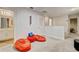 Loft area with beanbag chairs and access to a bathroom at 1567 Carey Palm Cir, Kissimmee, FL 34747
