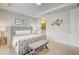 Spacious Primary bedroom with a comfortable bed and ensuite bathroom at 1567 Carey Palm Cir, Kissimmee, FL 34747