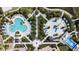 A bird's-eye view of the community pools, splash pad, and surrounding lounge areas at 1567 Carey Palm Cir, Kissimmee, FL 34747