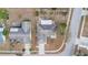 Aerial view of a home with a screened enclosure and surrounding neighborhood at 2124 Cassingham Cir, Ocoee, FL 34761