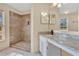 Bathroom with a walk-in shower, granite countertop, and modern fixtures at 2124 Cassingham Cir, Ocoee, FL 34761