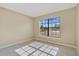 Bright bedroom with large window and tile flooring at 2124 Cassingham Cir, Ocoee, FL 34761