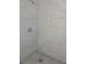 Close-up of a modern walk-in shower with marble tile and a sleek design at 2449 Sunset Dr, Lake Wales, FL 33898