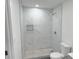 Modern bathroom with walk-in shower featuring elegant marble tile at 2449 Sunset Dr, Lake Wales, FL 33898