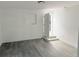 Open living room with gray wood-look flooring and recessed lighting at 2449 Sunset Dr, Lake Wales, FL 33898
