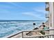 Oceanfront balcony with views of the beach and pool at 2967 S Atlantic Ave # 504, Daytona Beach Shores, FL 32118