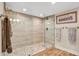 Elegant bathroom featuring a spacious walk-in shower with pebble tile accents at 2967 S Atlantic Ave # 504, Daytona Beach Shores, FL 32118