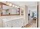 Stylish bathroom with white vanity, marble countertop, and a walk-in shower at 2967 S Atlantic Ave # 504, Daytona Beach Shores, FL 32118