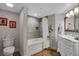 Updated bathroom featuring a white vanity, tiled shower, and modern fixtures at 2967 S Atlantic Ave # 504, Daytona Beach Shores, FL 32118