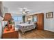 Bedroom with ocean view, wood-look tile floor, and built-in wardrobe and bed at 2967 S Atlantic Ave # 504, Daytona Beach Shores, FL 32118