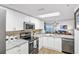 Updated kitchen featuring stainless steel appliances, granite countertops, and white cabinetry at 2967 S Atlantic Ave # 504, Daytona Beach Shores, FL 32118