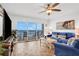 Inviting living room with comfortable blue furniture and stunning ocean views at 2967 S Atlantic Ave # 504, Daytona Beach Shores, FL 32118