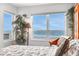 Bright main bedroom with large windows showcasing stunning ocean views at 2967 S Atlantic Ave # 504, Daytona Beach Shores, FL 32118