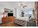 Relaxing main bedroom featuring ocean views, a ceiling fan, and wooden furniture at 2967 S Atlantic Ave # 504, Daytona Beach Shores, FL 32118