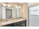 Modern bathroom with dual sinks, marble tile shower, and granite countertop at 3251 Crown Jewel Ct, Winter Park, FL 32792