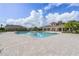 Community pool with a shaded pavilion and surrounding pavers at 3541 Sandalwood Isle Way, Ocoee, FL 34761