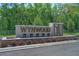 Wynwood community entrance sign framed by trees and landscaping at 3541 Sandalwood Isle Way, Ocoee, FL 34761