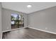 Empty bedroom with a large window overlooking a lake at 3966 Lake Mira Dr, Orlando, FL 32817