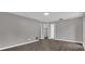 Empty bedroom with gray walls, wood-look flooring, and open door to closet at 3966 Lake Mira Dr, Orlando, FL 32817