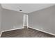 Empty bedroom with gray walls and dark wood-look laminate flooring at 3966 Lake Mira Dr, Orlando, FL 32817