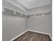 Spacious walk-in closet with built-in shelving and gray walls at 3966 Lake Mira Dr, Orlando, FL 32817