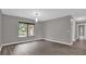 Bright dining room with large windows providing ample natural light at 3966 Lake Mira Dr, Orlando, FL 32817