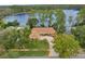 Beautiful home on a lakeside lot with lush landscaping and mature trees at 3966 Lake Mira Dr, Orlando, FL 32817