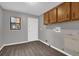 Laundry room with wood cabinets, washer and dryer hookups, and gray walls at 3966 Lake Mira Dr, Orlando, FL 32817