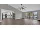 Inviting living room with large windows showcasing a picturesque lake view at 3966 Lake Mira Dr, Orlando, FL 32817