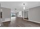 Spacious living and dining area with modern flooring and neutral paint at 3966 Lake Mira Dr, Orlando, FL 32817
