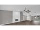 Spacious living room with vaulted ceiling, shiplap accent wall, and modern fireplace at 3966 Lake Mira Dr, Orlando, FL 32817