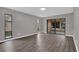 Open living area with sliding glass doors leading to a private outdoor space at 3966 Lake Mira Dr, Orlando, FL 32817
