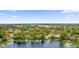 Scenic view of a lakeside community with beautiful homes and docks at 3966 Lake Mira Dr, Orlando, FL 32817