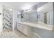 Bathroom with updated vanity, large mirror, and shower/tub combo at 4344 Aqua Vista Dr # B, Orlando, FL 32839