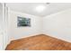 Empty bedroom with hardwood floors and white walls at 5024 Saint Germain Ave, Belle Isle, FL 32812