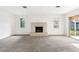 Large living room with fireplace, sliding glass door, and plush carpet at 5024 Saint Germain Ave, Belle Isle, FL 32812