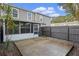 Private backyard patio with screened enclosure and seating area at 505 Shadow Glenn Pl, Winter Springs, FL 32708