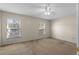 Bright bedroom with two windows and carpeted floor at 505 Shadow Glenn Pl, Winter Springs, FL 32708