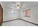 Bright bedroom with tiled floors and ceiling fan at 532 Maricopa Dr, Kissimmee, FL 34758